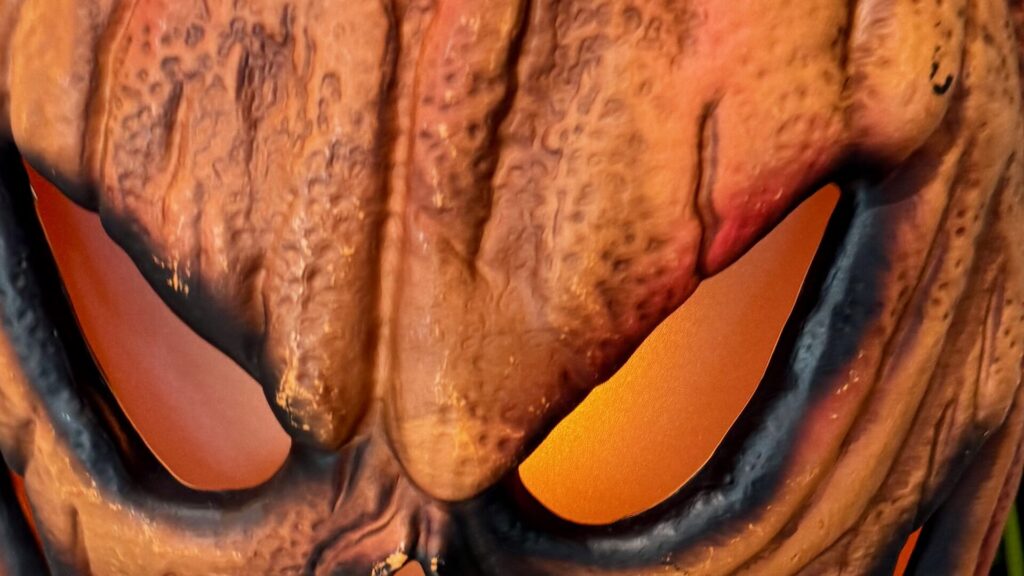 Close up on the cut out eyes of a Halloween pumpkin