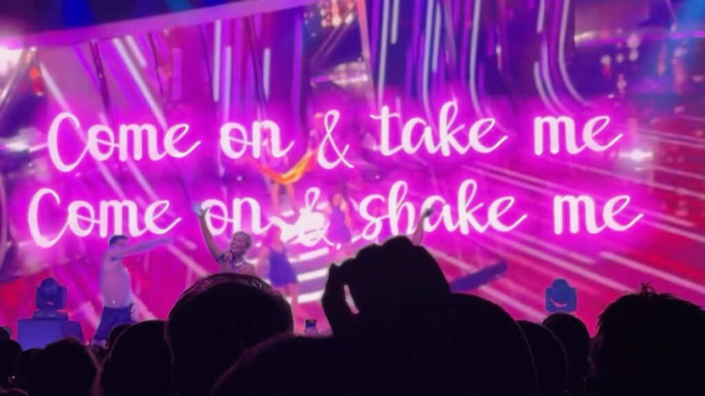 The stage lit up with the words 'Come On and Take Me, Come On and Shake Me' as part of the Eurovision On Tour performance in London.